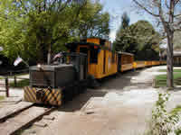 The small engine attaching a caboose to the train